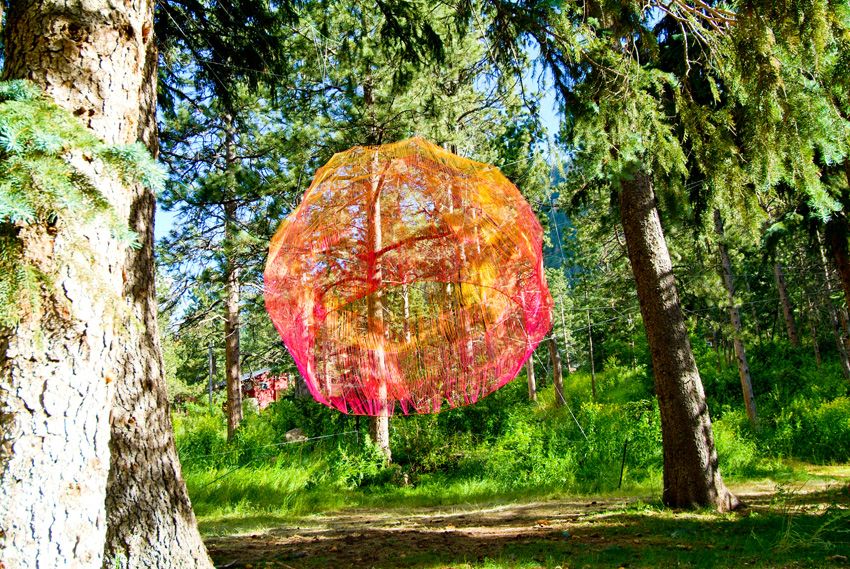 Hanging red ball on tree, art